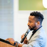 An Alumnus giving a speech.